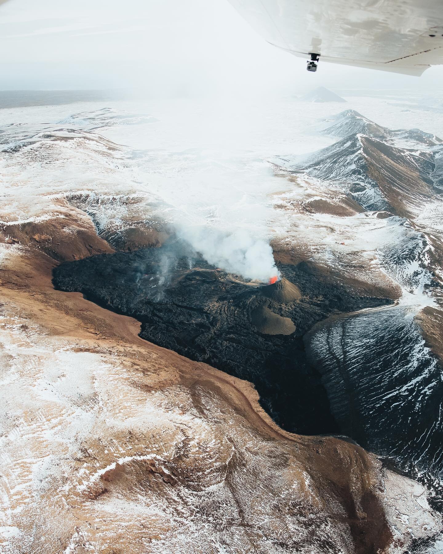 Flying over a volcano. These shots were taken from a plane early this morning. It's incredible to see how much of the valley has actually been filled with lava by now. It's not long since you could stand right next to the volcano which has now grown 
