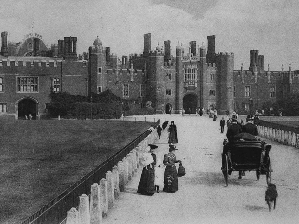 Hampton Court Palace with dog chasing carriage