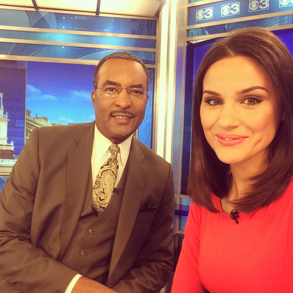 Nicole Brewer poses alongside co-anchor and friend Ukee Washington