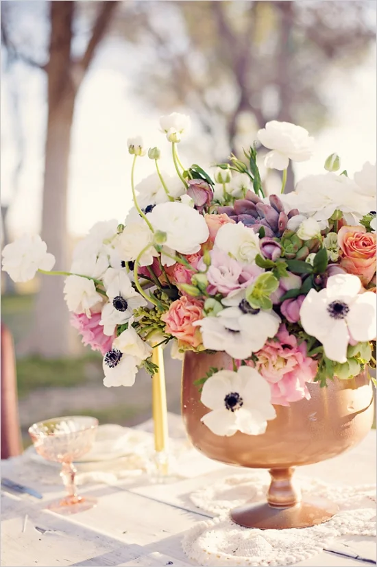 Copper urn with white anemones, freesias and coral roses.