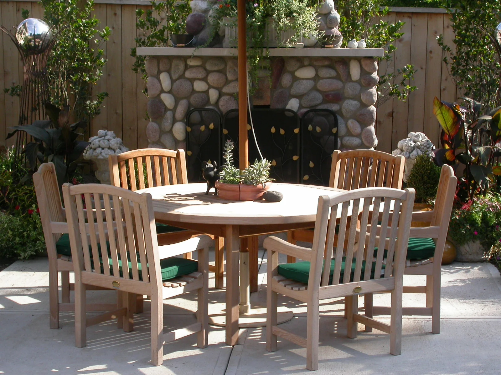  Round stone fireplace with limestone mantle. 