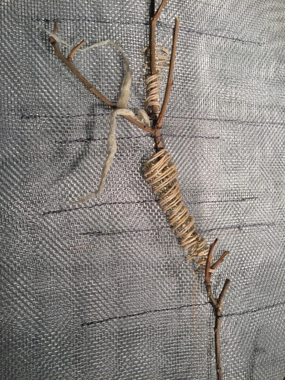 Scape “Never Twice the Same” aluminum mesh, waxed brown paper, oak twigs, waxed linen machine stitching 6 ft. x 14” approximately call the gallery for a more detailed description and photo