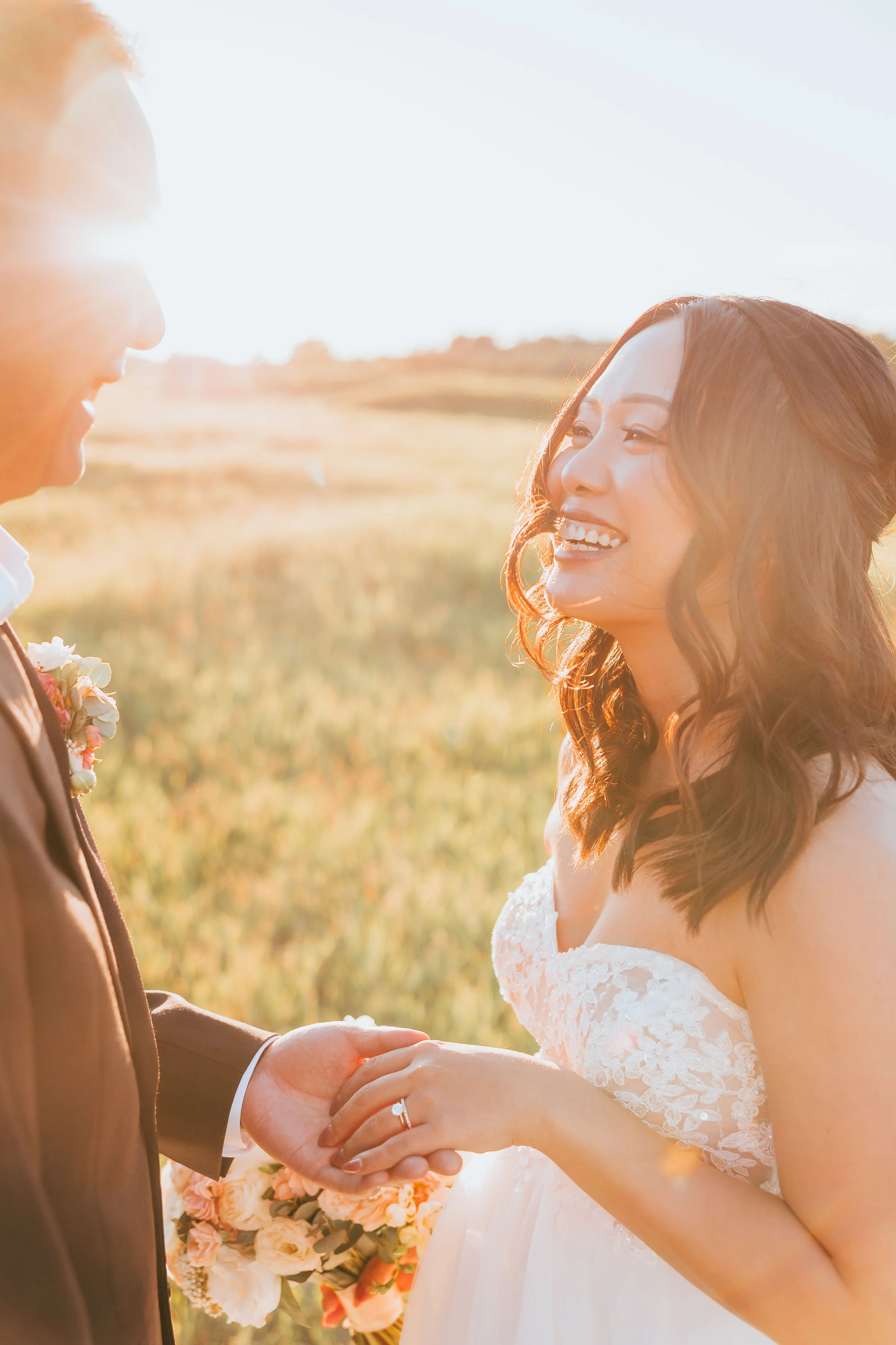 Casual elopement couple in Calgary park with natural greenery, soft light, and relaxed classic wedding attire during outdoor ceremony