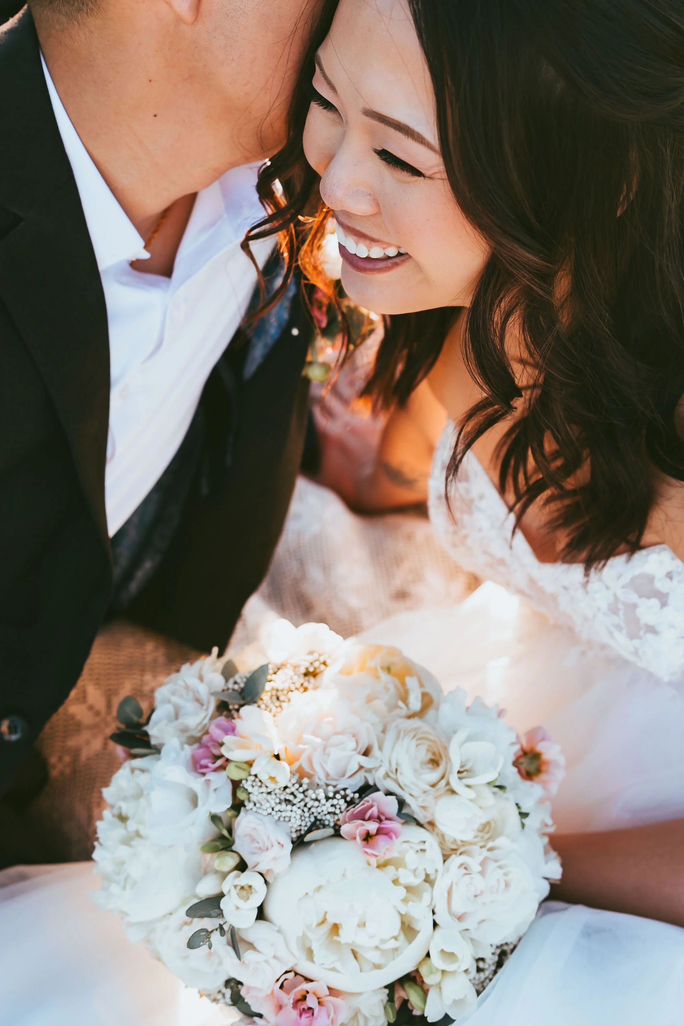 Casual elopement couple in Calgary park with natural greenery, soft light, and relaxed classic wedding attire during outdoor ceremony
