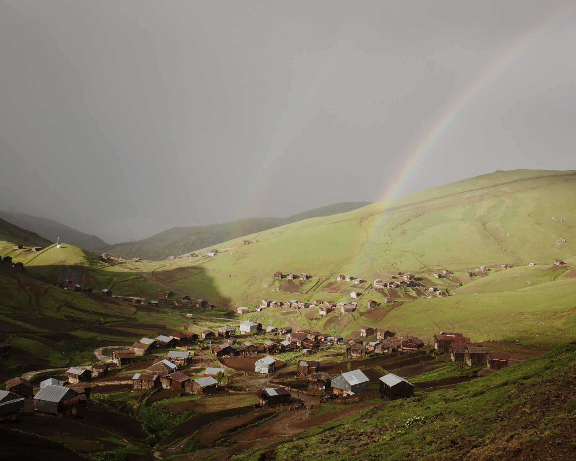  A rainbow after the storm. Zortikheli is the mountain pasture village of the inhabitants of Ghorjomi. A big part of the men and some families come here for a few monthes with their cattles. They have everything here: shop, school, etc 