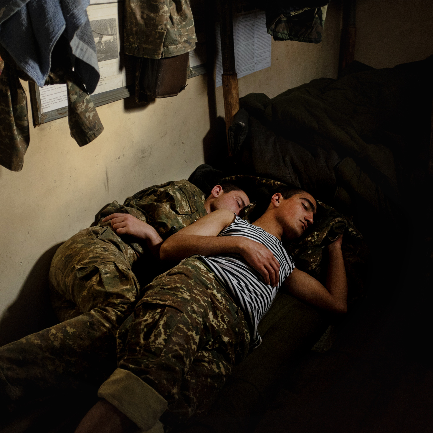  Two young soldiers having rest on the contact line 