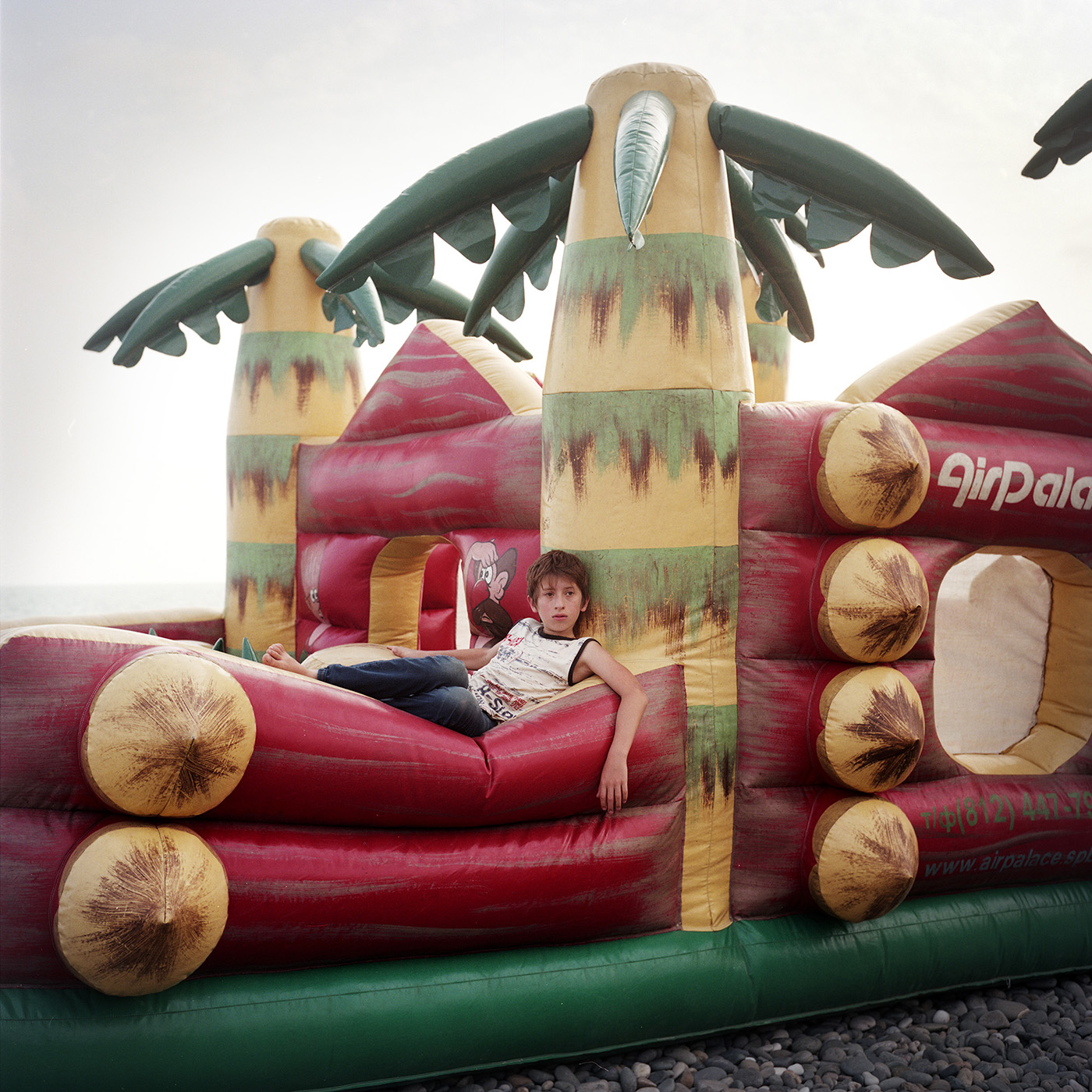  A young boy on a bouncy castle on Sukhum(i) Beach.    