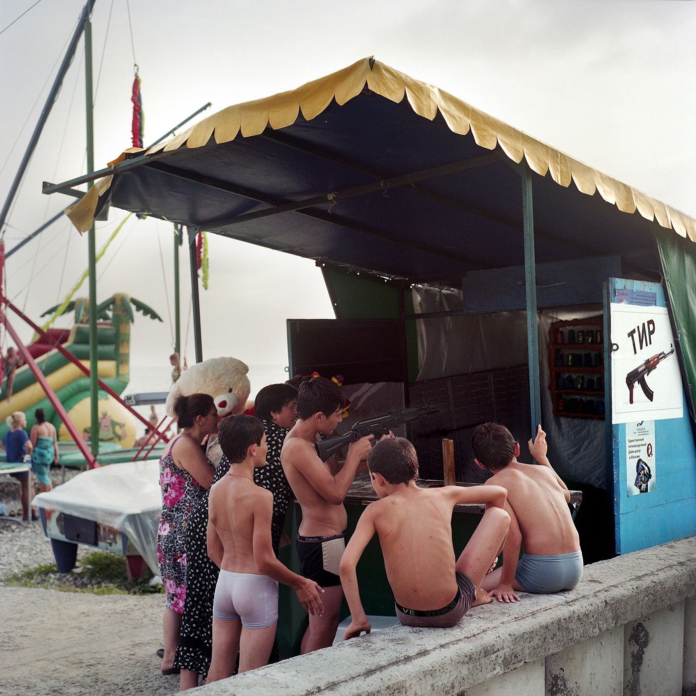  Kids playing at a shooting game on Sukhum(i) Beach. 