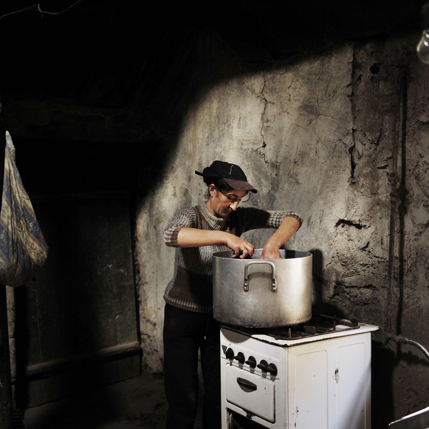  Anoush cook canned peppers. The cans are stored for the winter. The village's families are almost self-subsistent: fruits and vegetables from the garden, milk, butter and cheese from the cows, homemade lavash. However the work to obtain this is huge