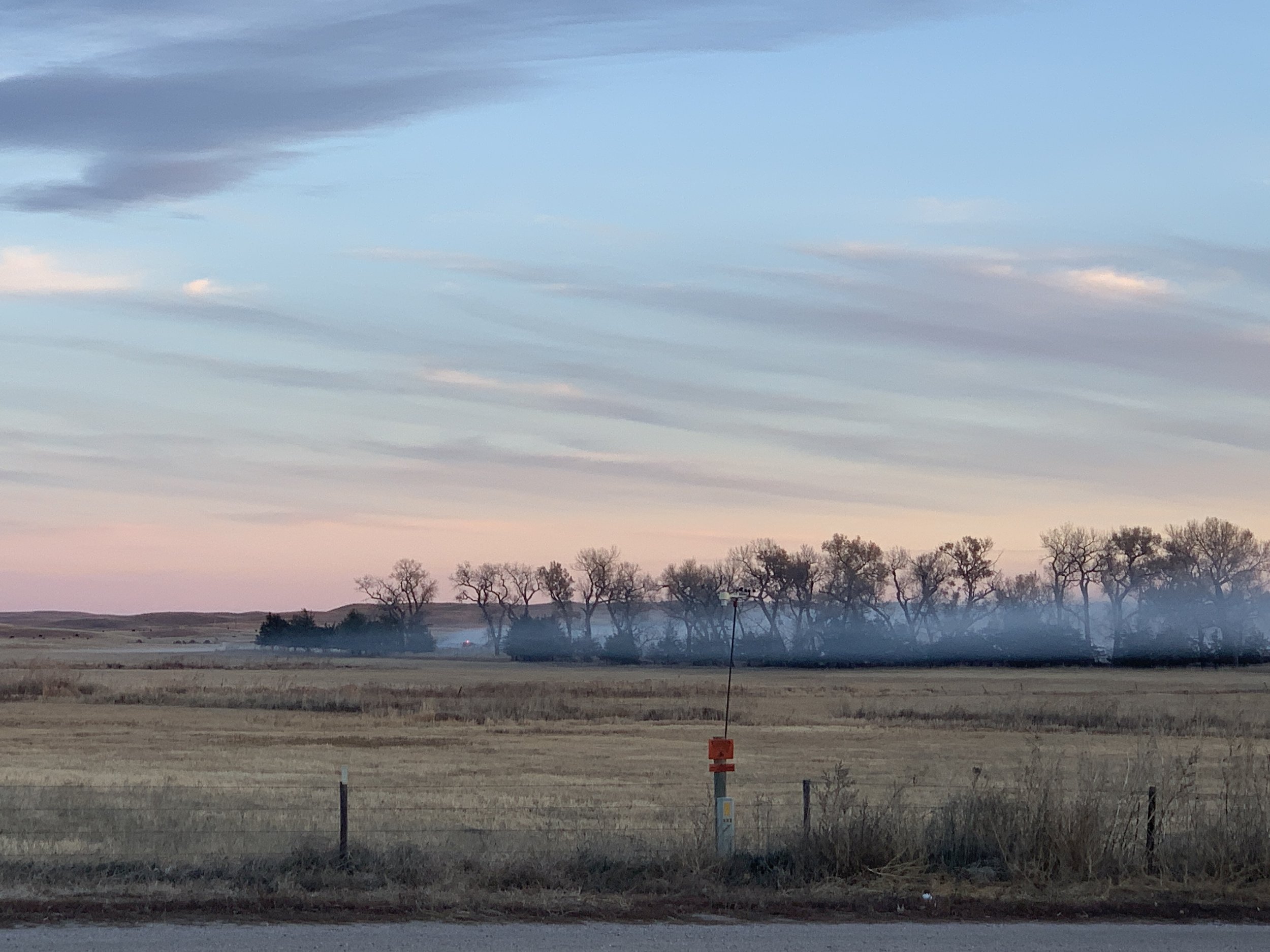  I was planting 300 daffodils in November, took a break on the back of our pickup and looked up to see a fire on the south side of our meadow (just south of where the hay bale was struck this summer). I was in disbelief at what I saw because there wa