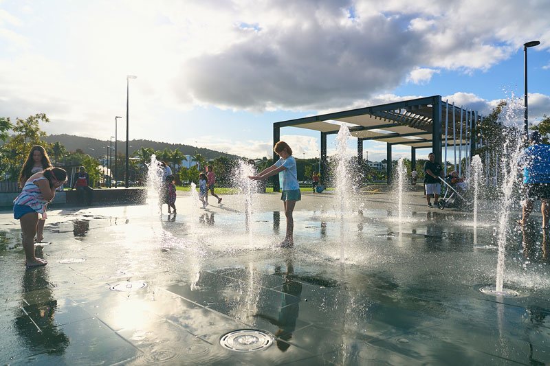 kids-playing-with-water-feature-during-day-time.jpeg