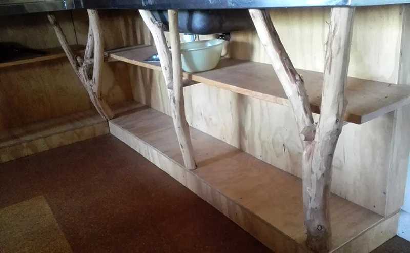 I love the way they have used branches in these shelves