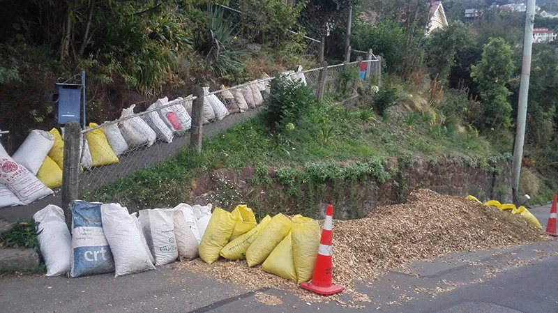 shredded-tree-clippings-for-garden-mulch-on-road-and-in-bags.jpg