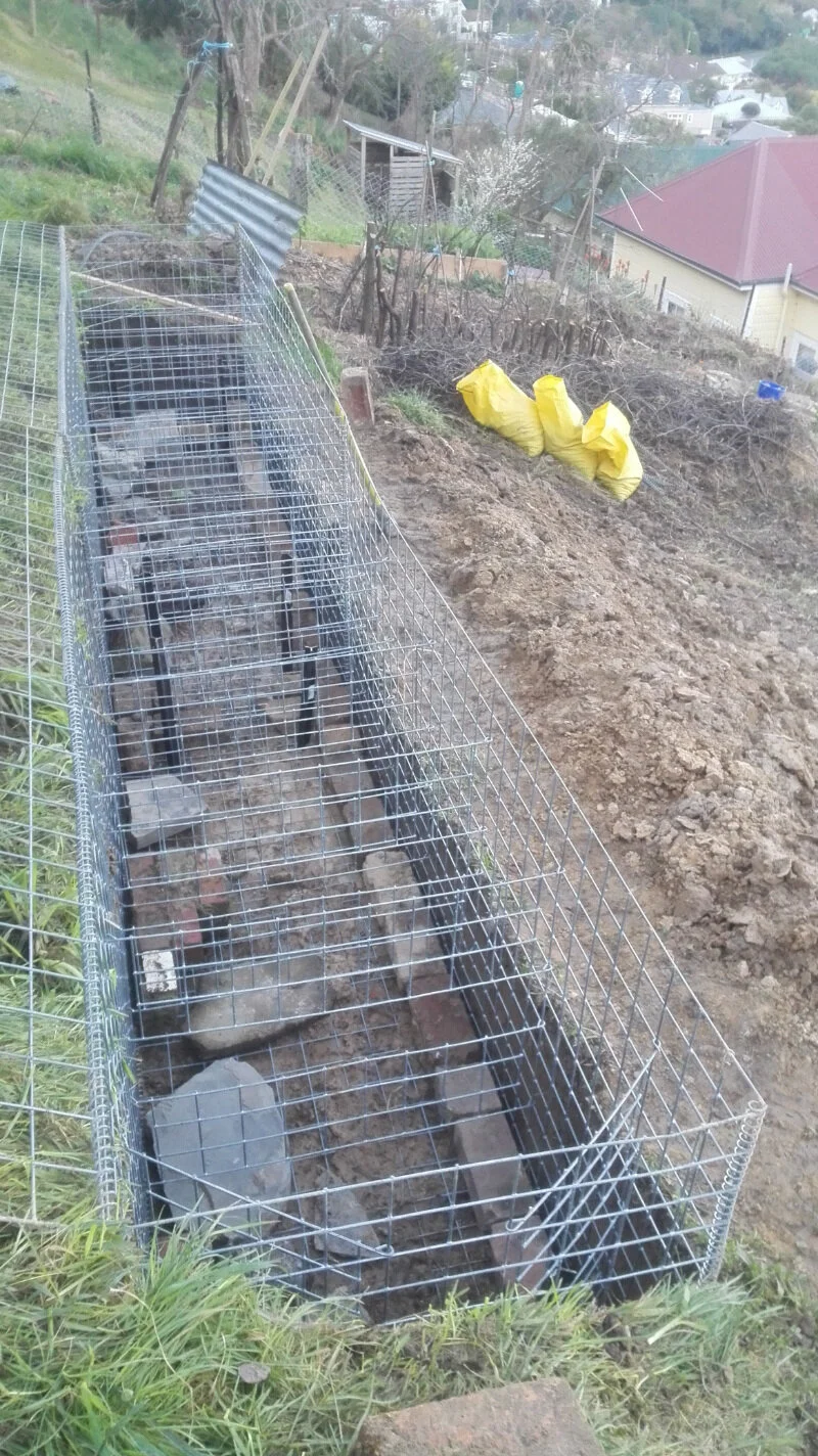 Though we have over a thousand bricks around the property, it’s not enough to fill the boxes, but it is a chance to get rid of all the old bits of pipe and rubble we have.