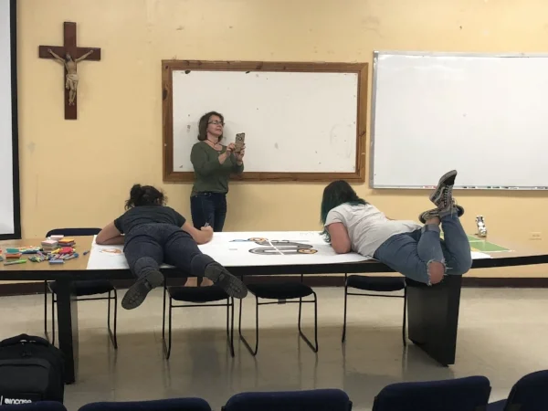 Hellem (left) and Daksha (right) prepare for the workshop in Pontificia Universidad Catolica with their short arms.