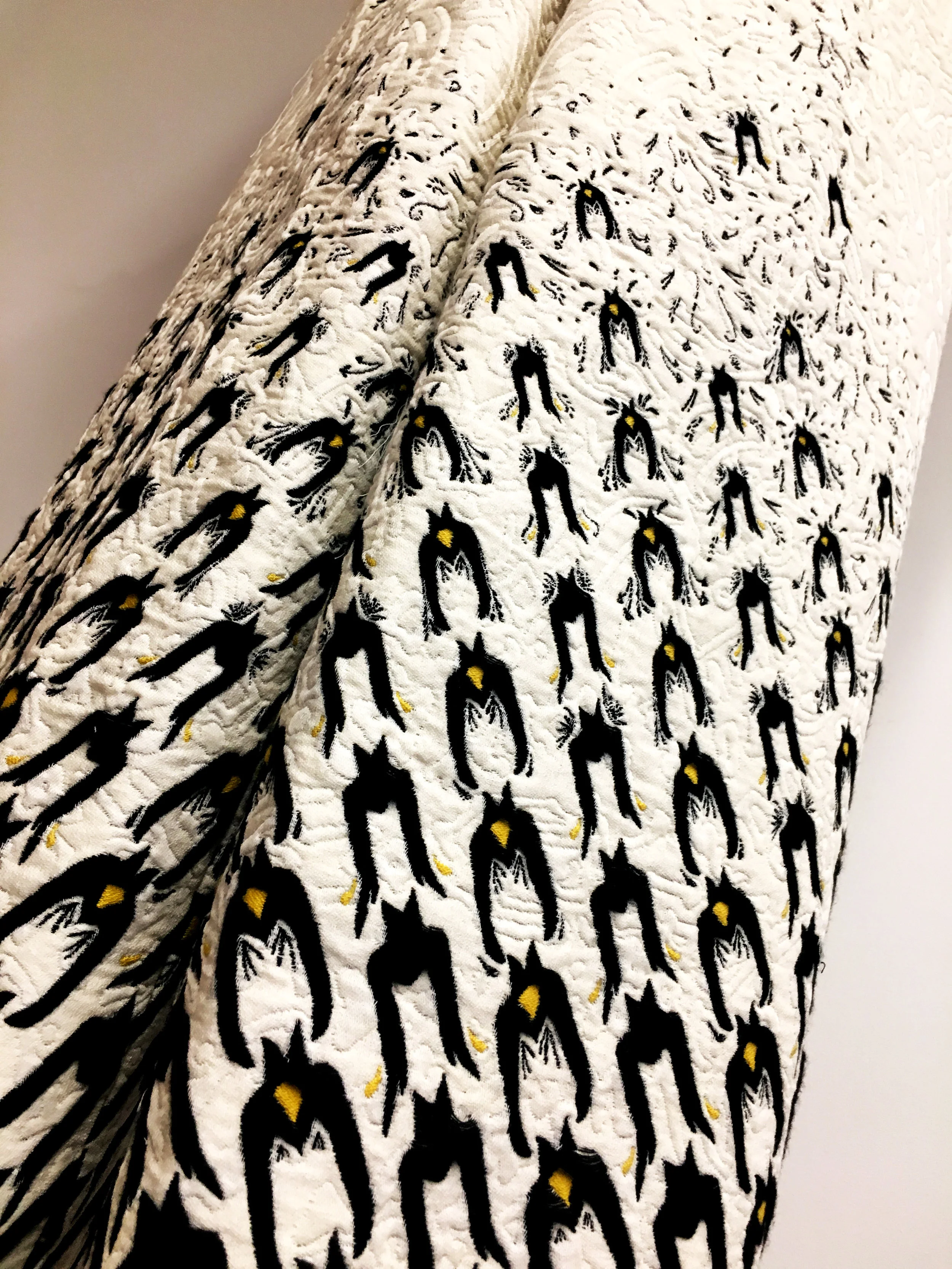  The textile is a double cloth with three tissue picks and multiple yarns that alternately run as a stuffer or is tacked to the back of the fabric.  