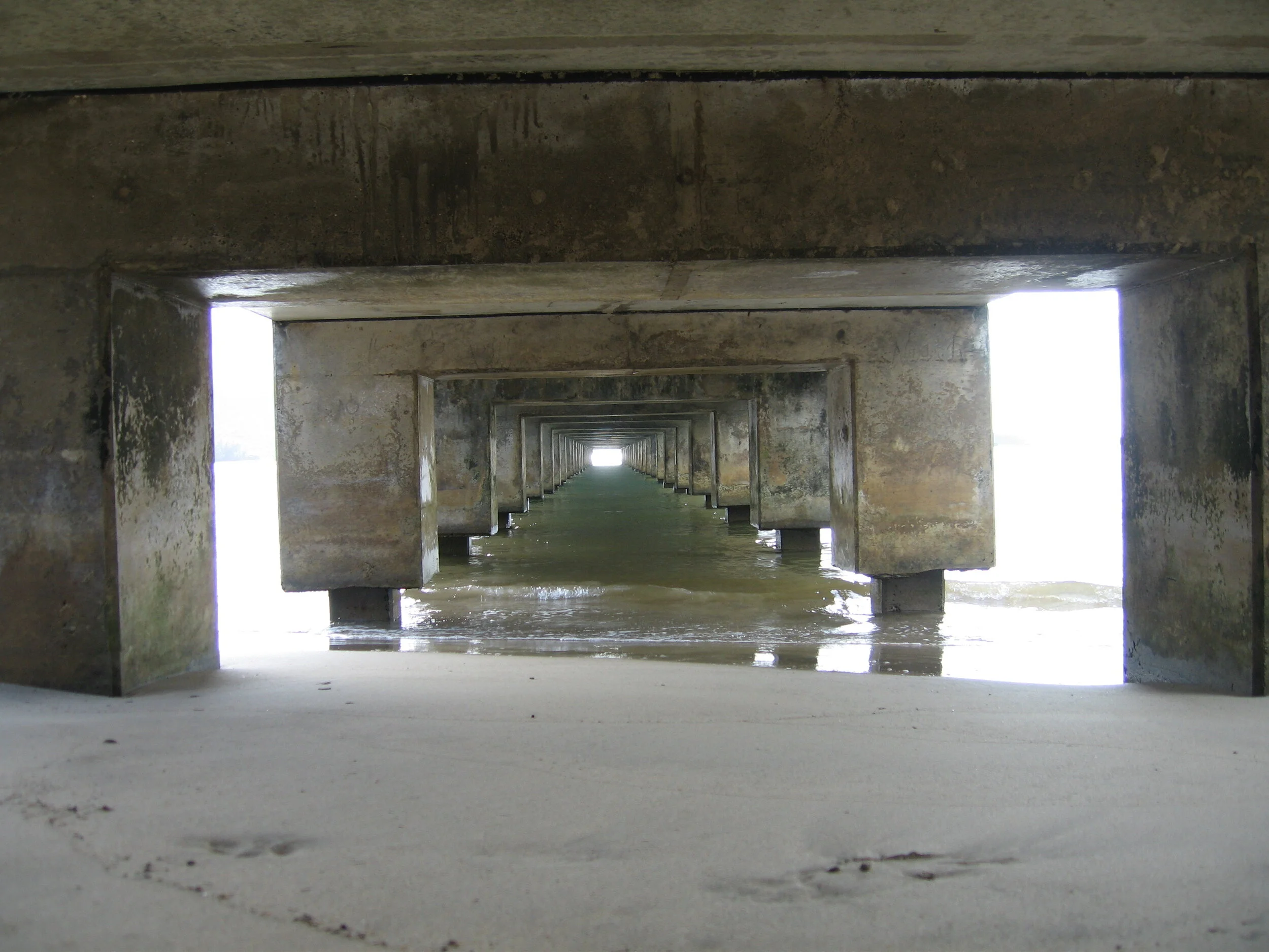 Connie Hunt Photography Underneath the Hanalei Pier on an Overcast Day