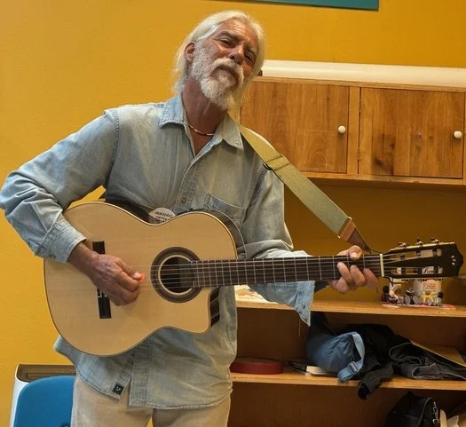Children’s book illustrator and musician Armando Ortega performing at the New Mexico Children’s Book Fair.