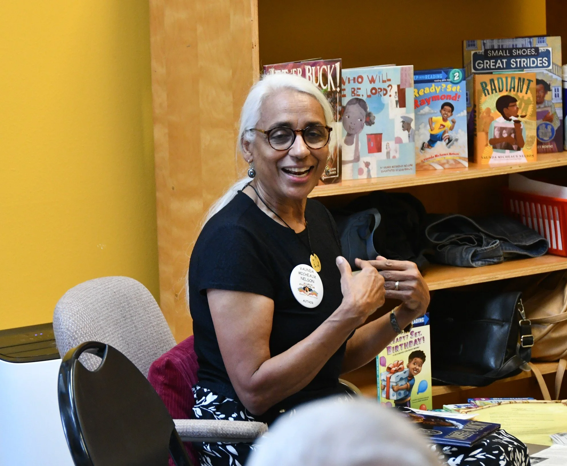 Author Vaunda Micheauz Nelson introducing herself to a group of children and parents.