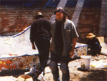  Rod Garrett working on mosaic tile installation 	with project volunteers Kerry Vandermeer and Arthur Monroe 	 
