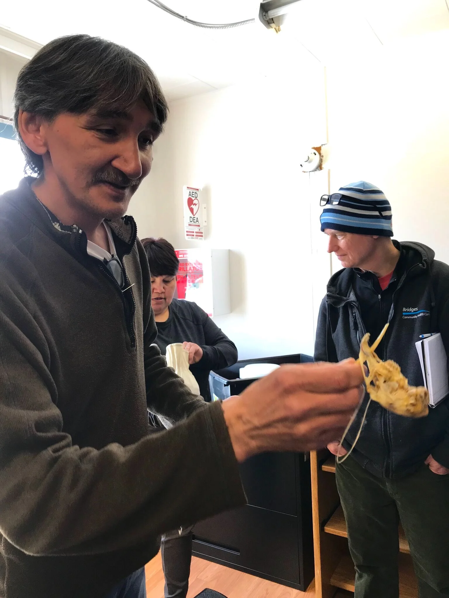 Jerry Natanine – Illisaqsivik Society, Clyde River showing us a traditional child's game