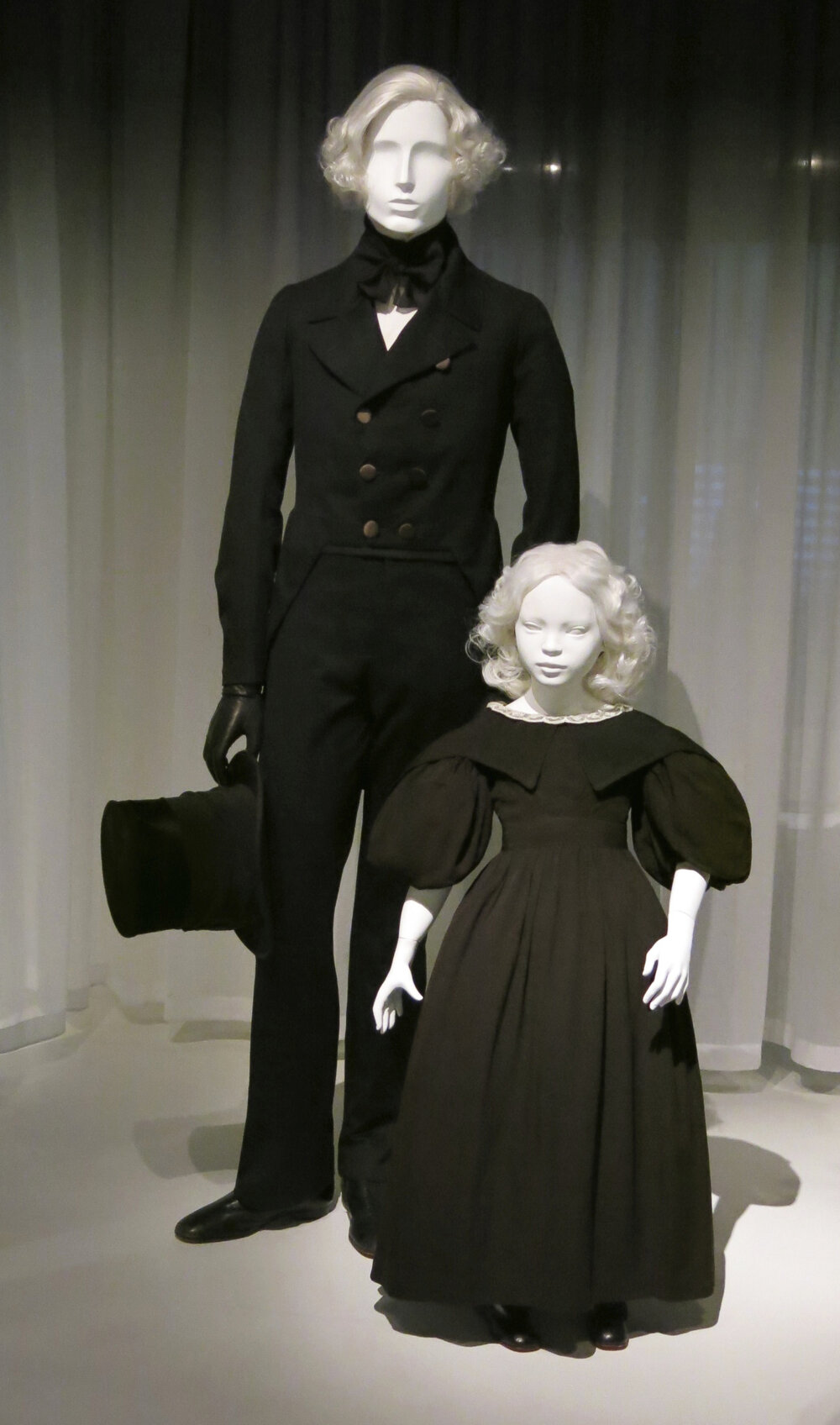 1830s American gentlemen's mourning tailcoat ensemble and girl's mourning dress.jpg