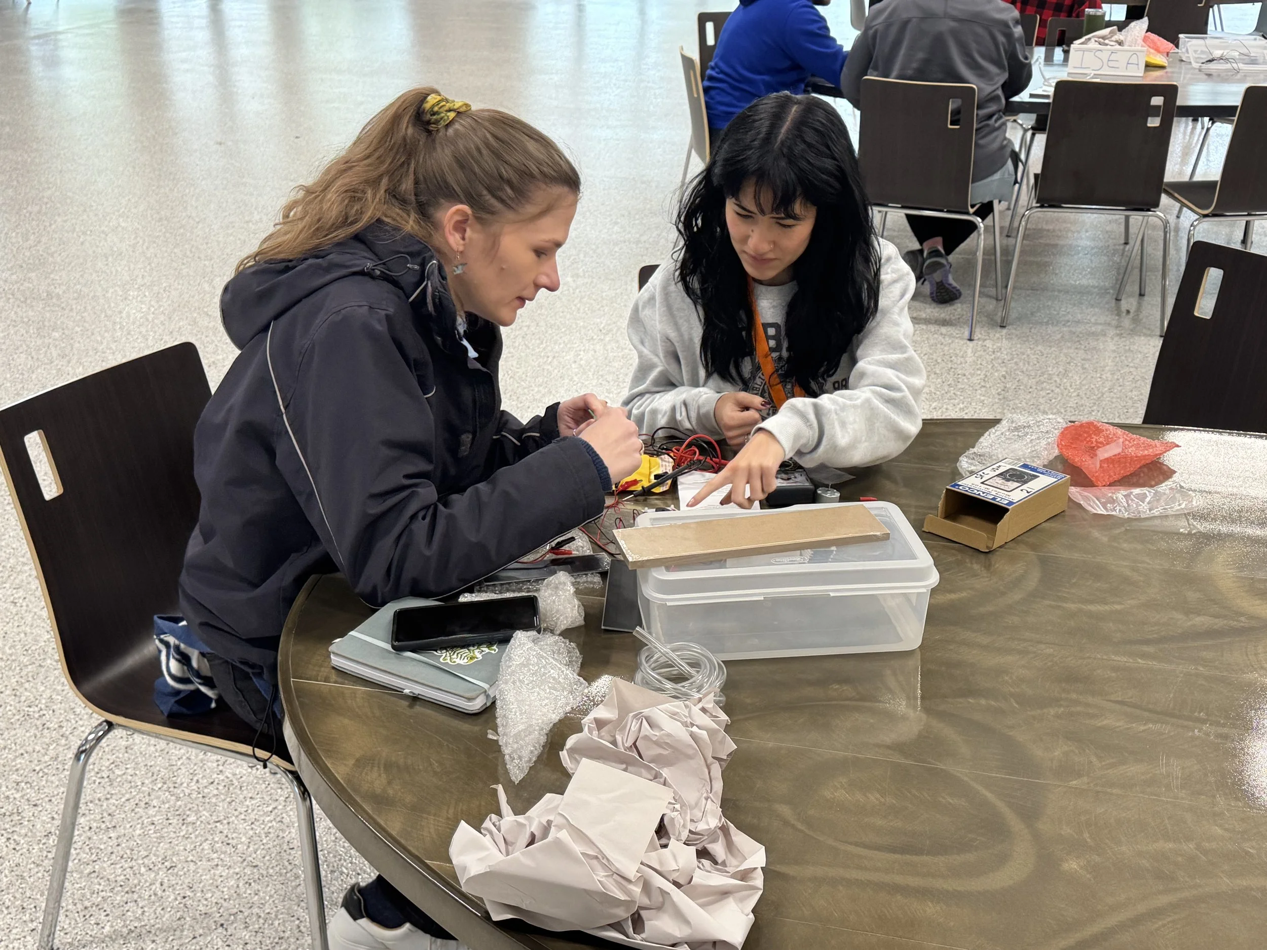 conference attendees work on stem related activity during session.