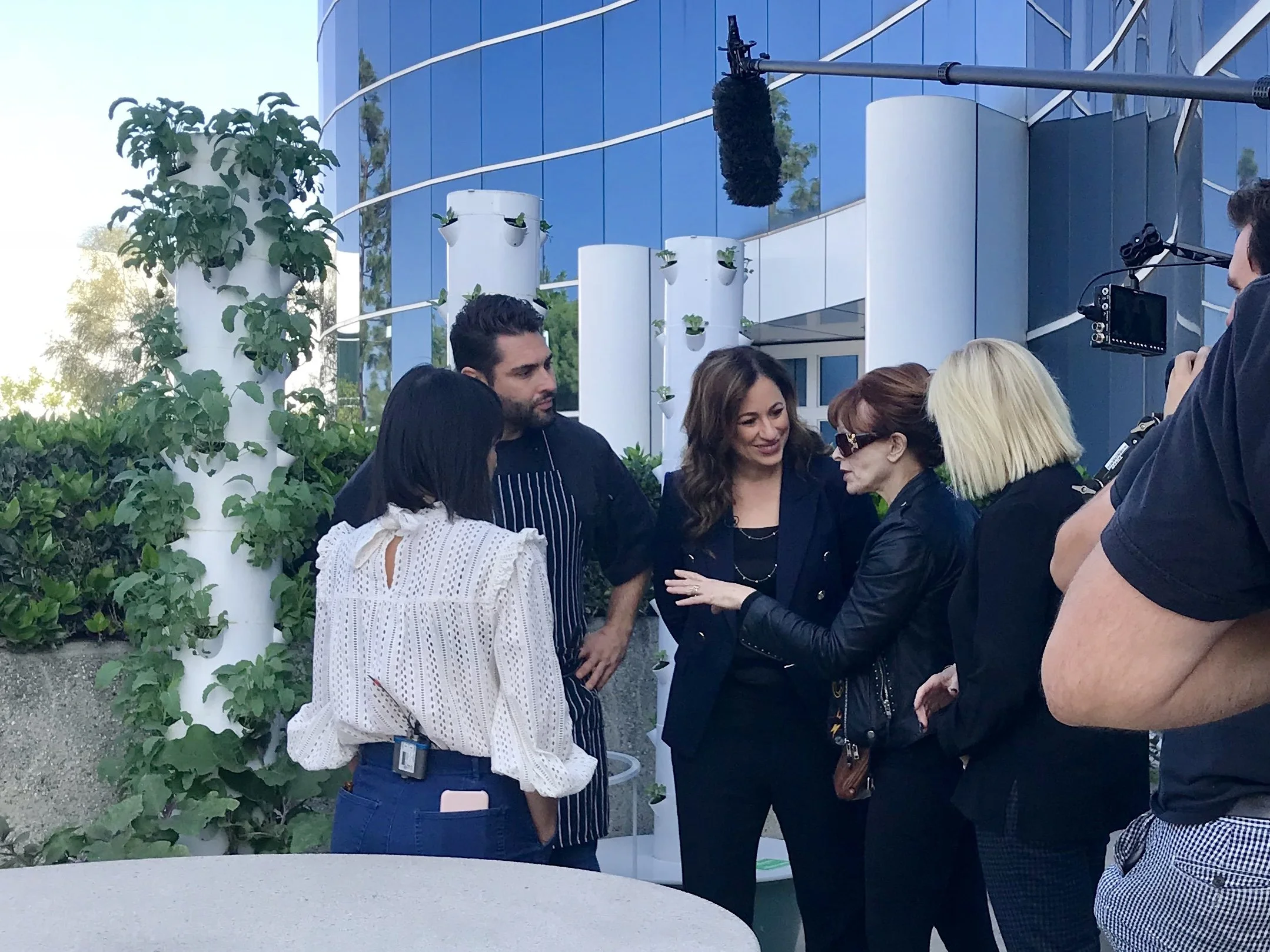 Kelly Vlahakis-Hanks, ECOS President and CEO shows the vertical gardens.