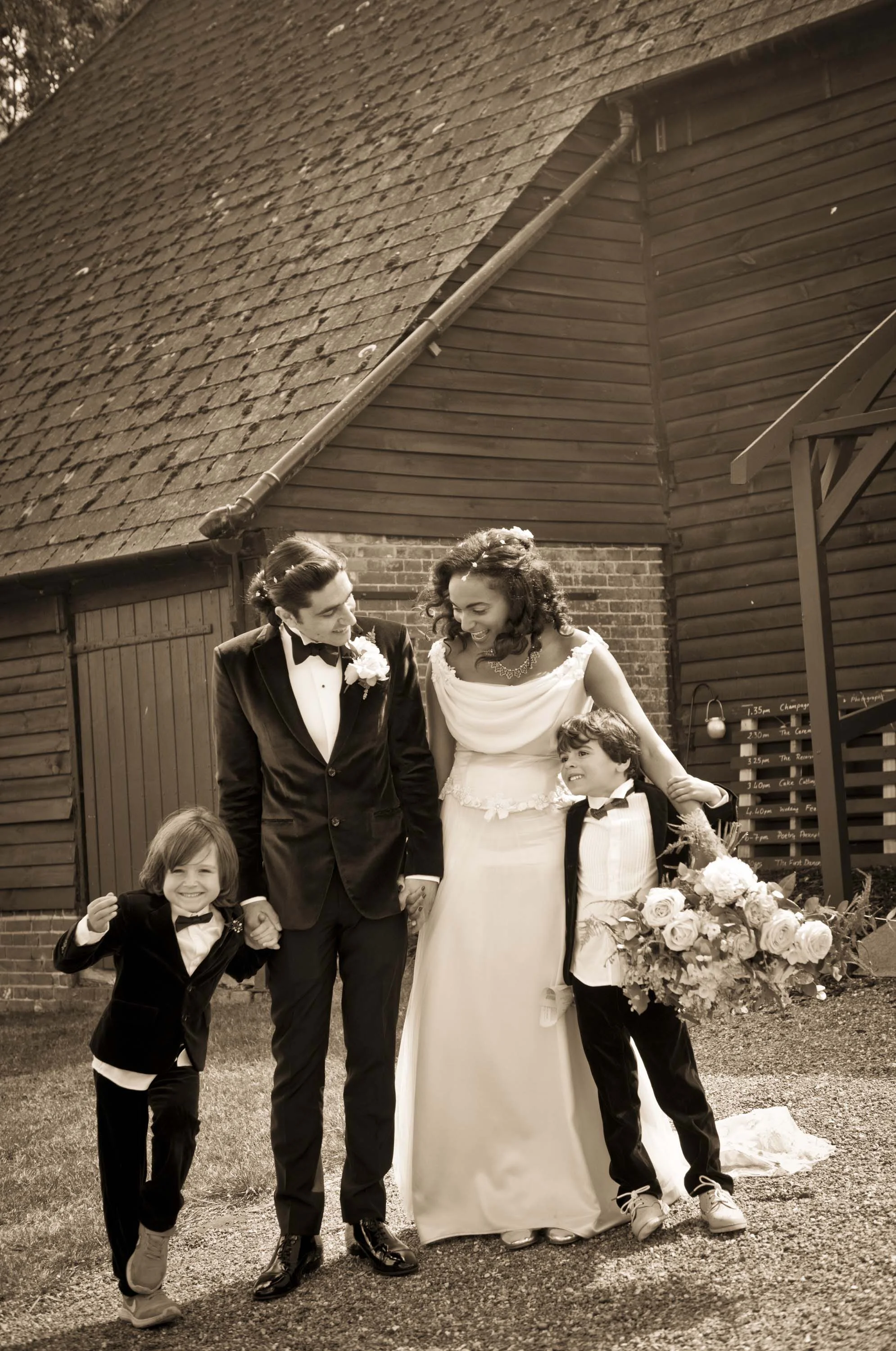 A Sussex Barn wedding with gorgeous original Art Deco touches created with heaps of creative passion... Fun, relaxed and rustic outdoor wedding photography in a Sussex barn. The sun shone on this lovely wedding between Jenny and Louis making for some truly beautiful photos.