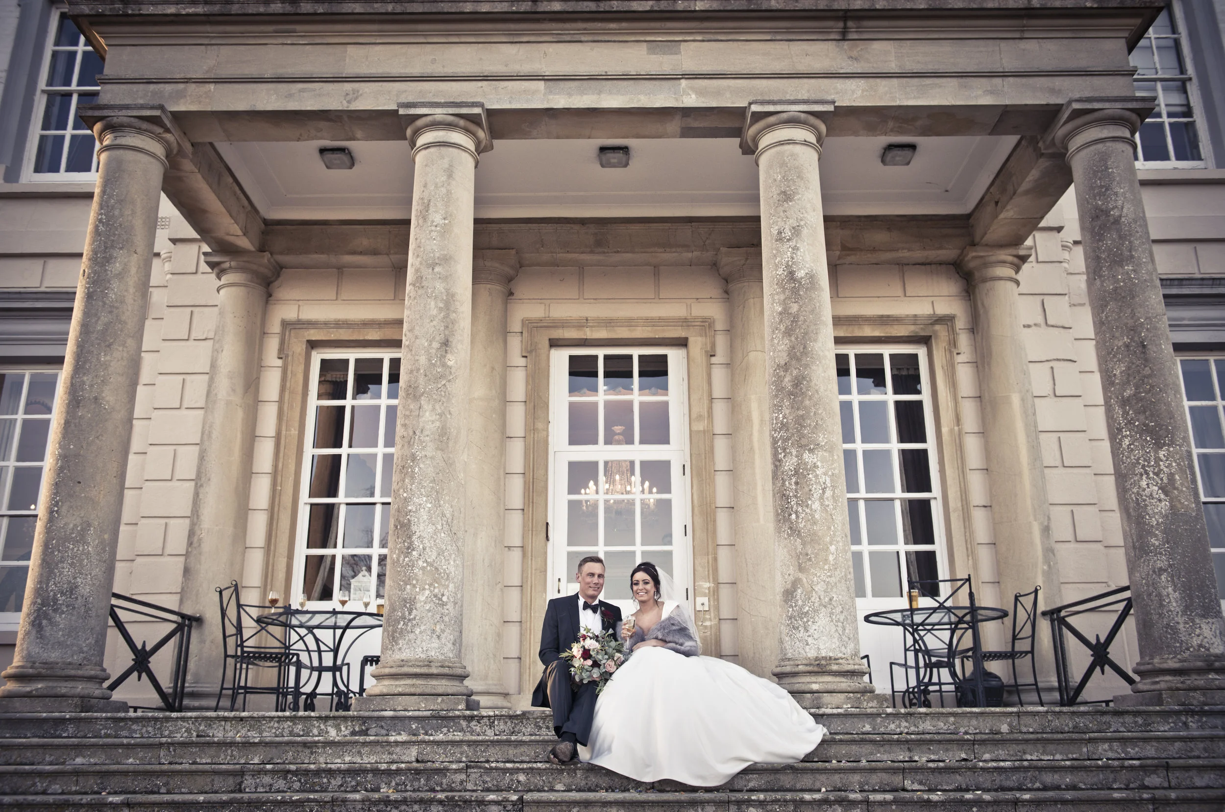 Bride and Groom Sitting on Steps Post Wedding Photography Sussex | Buxted Park Sussex Photography | Classic Elegant Wedding Photography Sussex