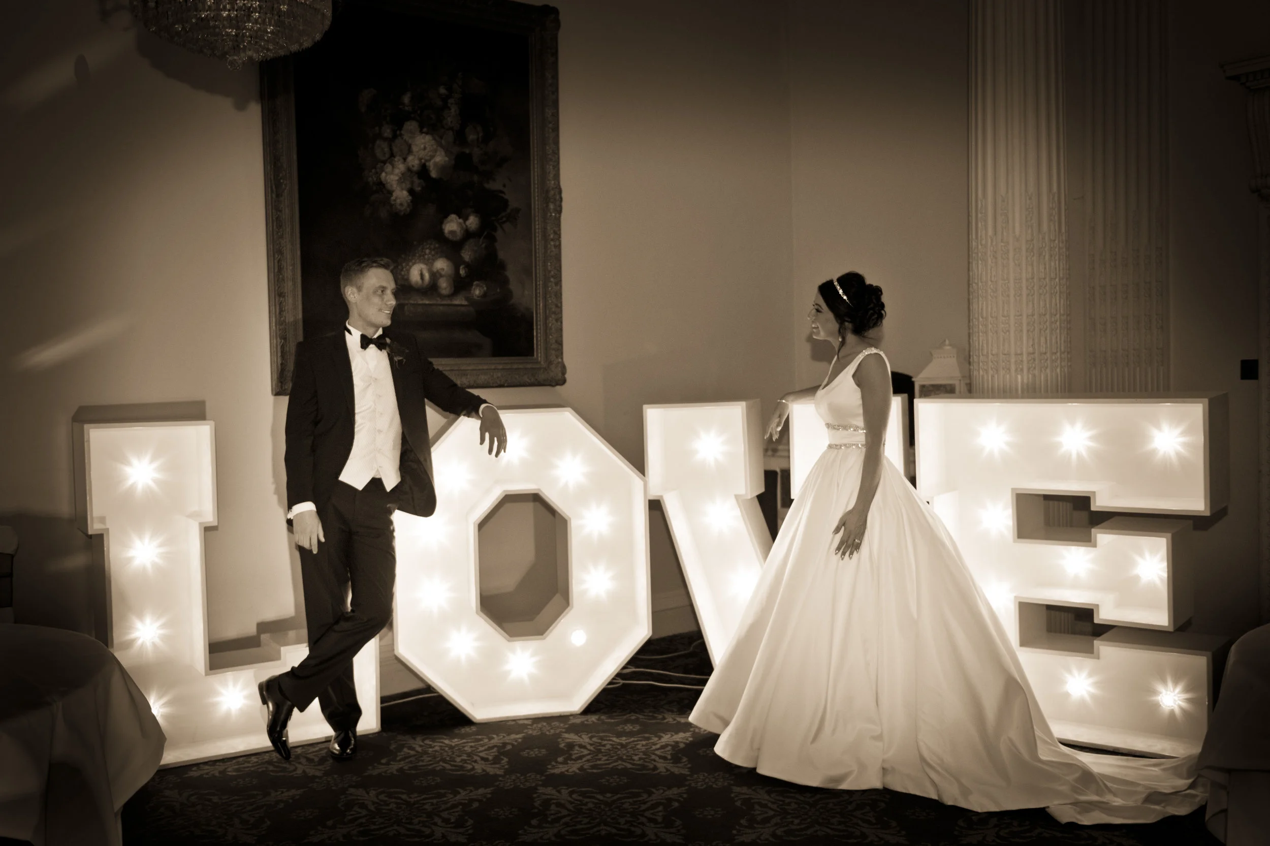 Bride and Groom Next to Love sign Post Wedding Photography Sussex | Buxted Park Sussex Photography | Classic Elegant Wedding Photography Sussex