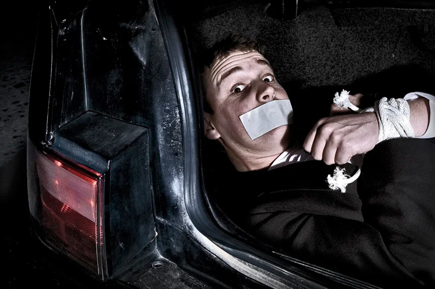 maninthetrunkofthecar1.jpg