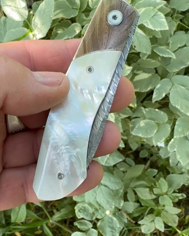 Time for a proper post of this stunning piece by @queiros.knives Andy took the handoff for Jim @blade_show and we were able to add our first MOP piece to the collection. Carlos makes jewelry level knives, many of them autos with his proprietary TRS d