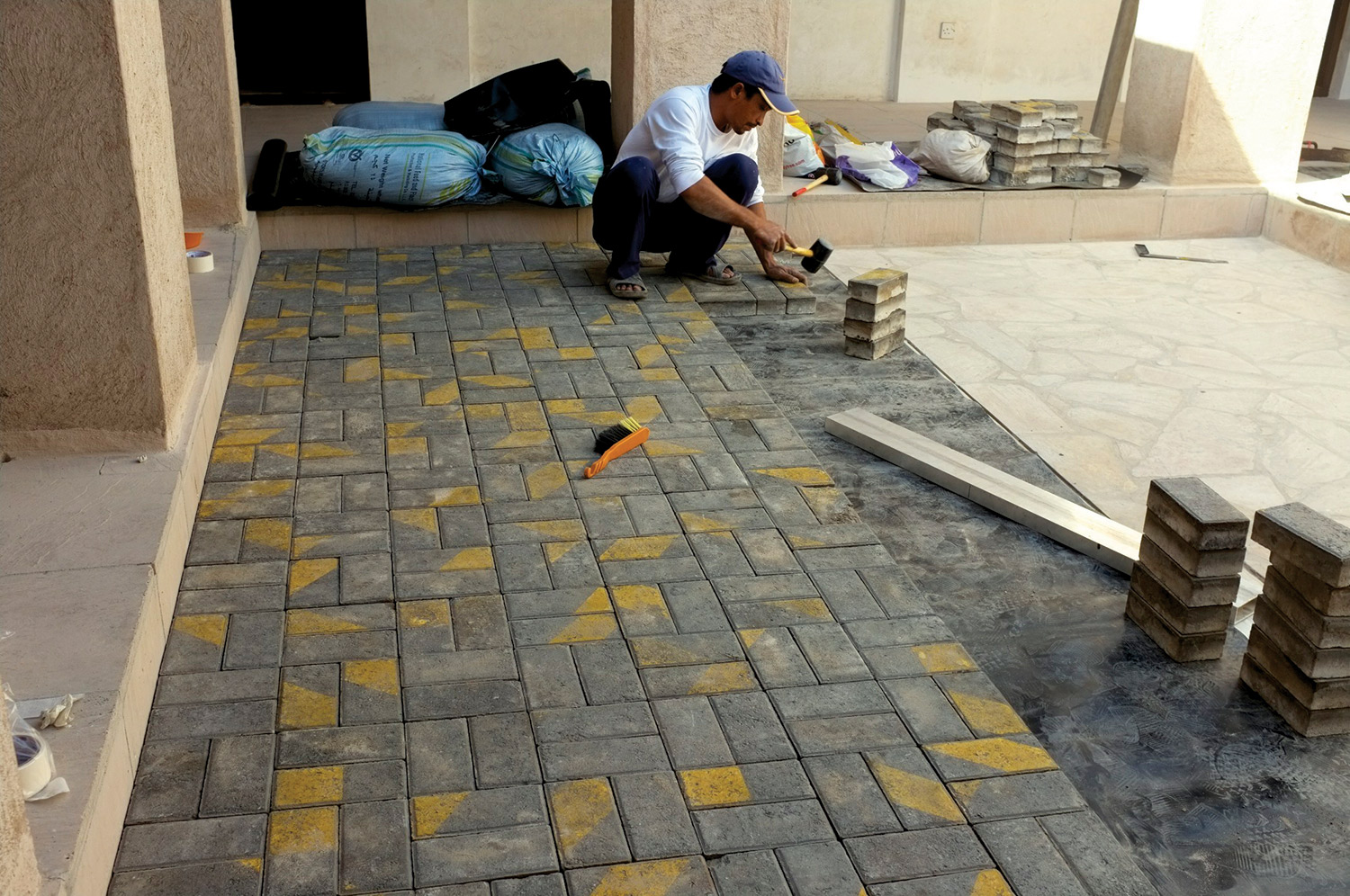  Pavement bricks being installed  Courtyard, House 33, Al Fahidi Historical Neighbourhood, Dubai 