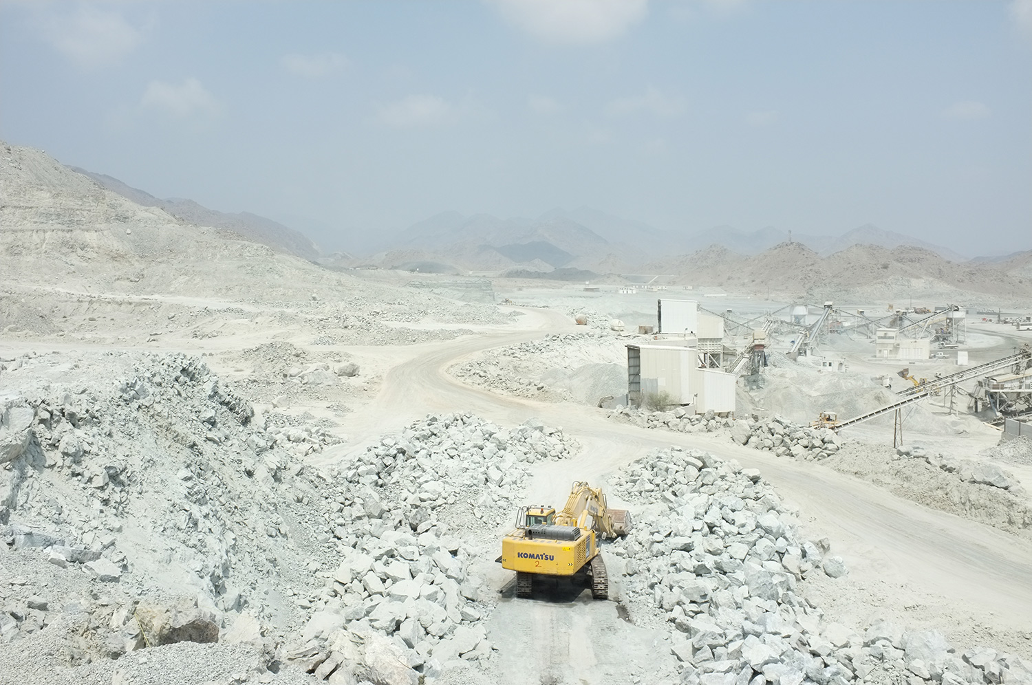  Excavator clearing site after explosion, Quarry, Fujairah  Research image 