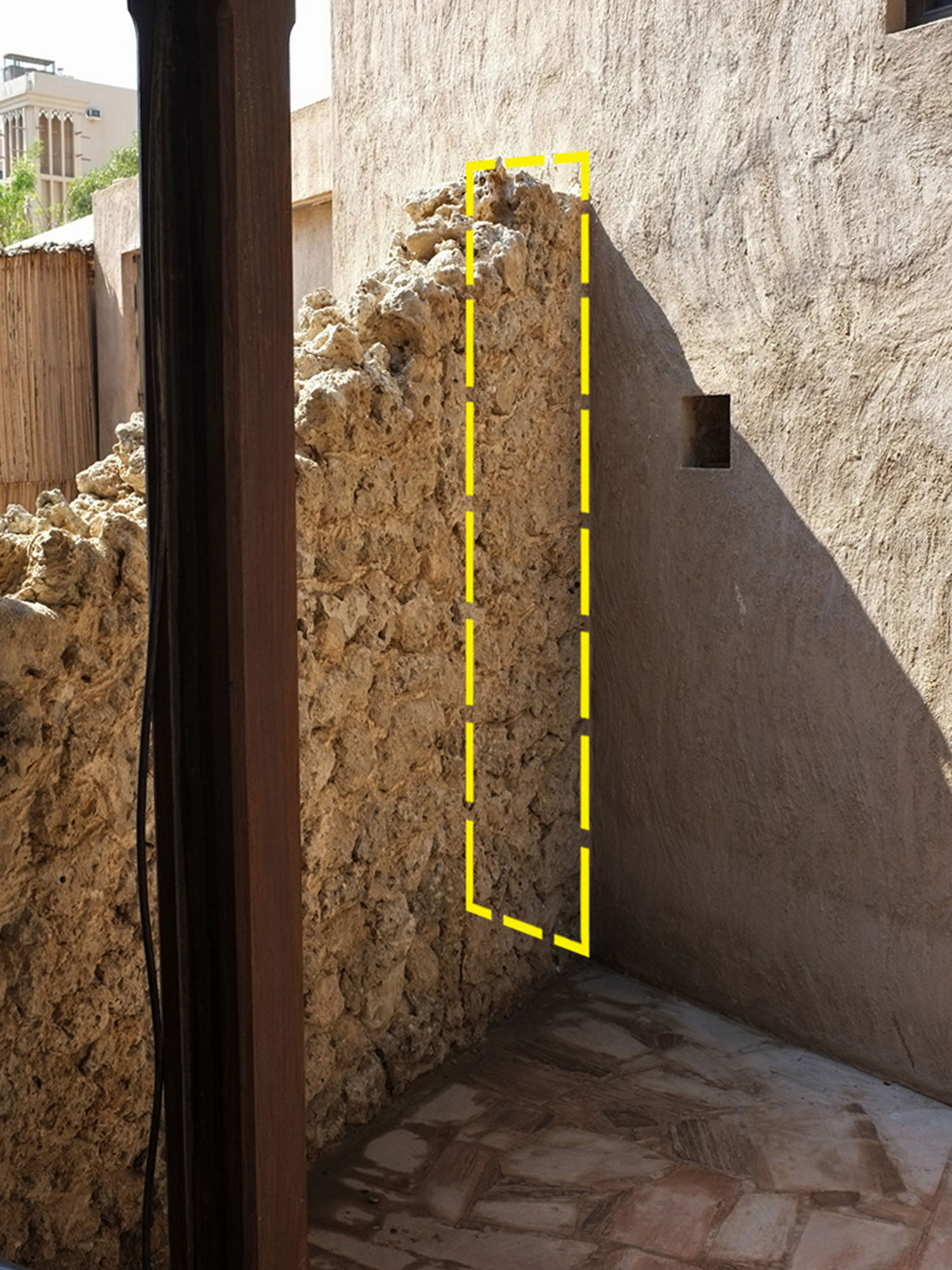  Preserved section of Historic Boundary wall  Al Fahidi Historical Neighbourhood  Highlighted in Yellow are the cross section dimension measuring 250cm (h) x 40cm (w) 
