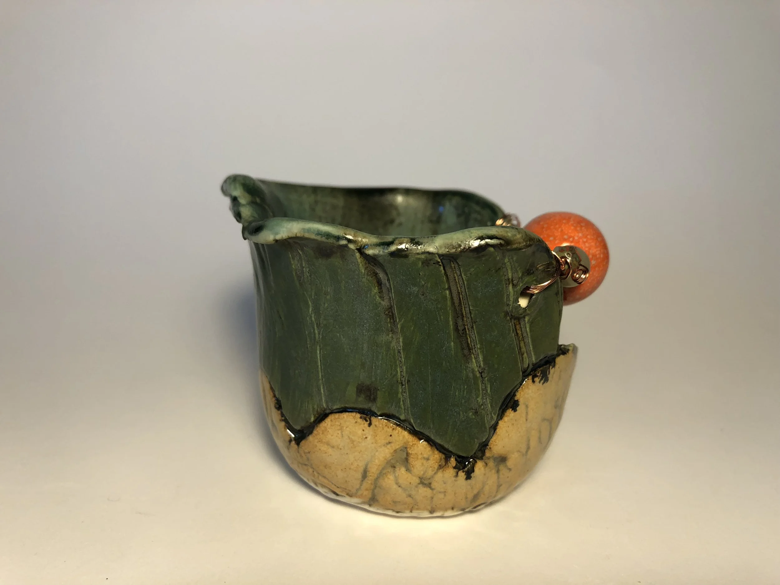 Seafoam green and orange votive