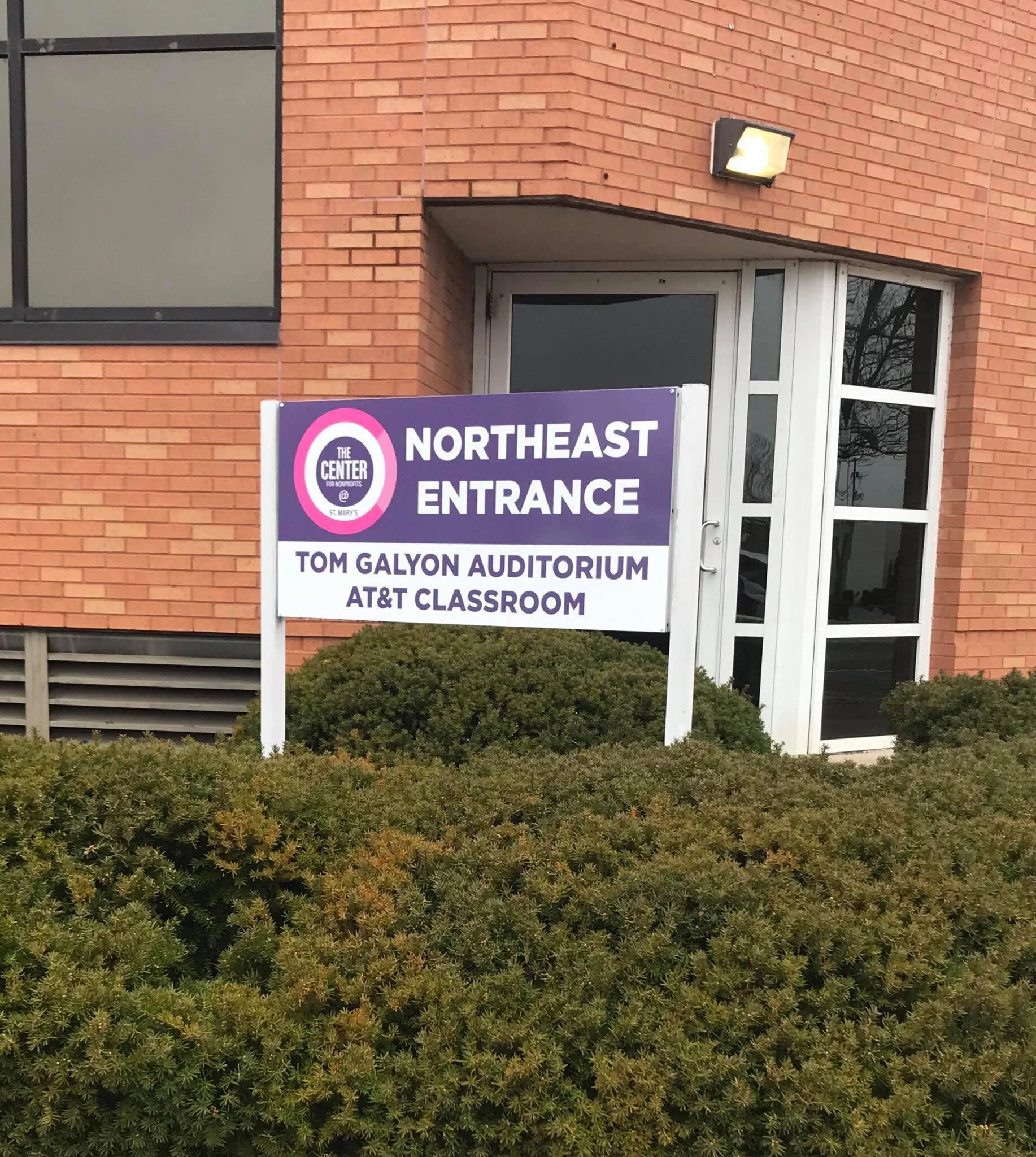 If you enter our office through the door behind this sign, you go down the stairs and into the first office on the right.
