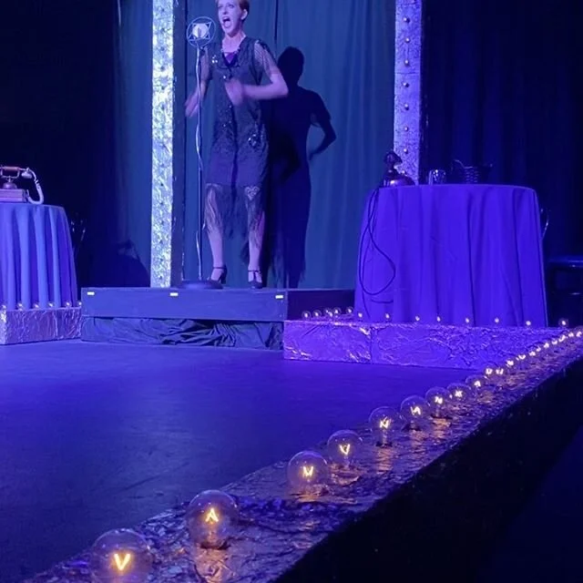 Inside - 
Everything is beautiful 
The girls are beautiful 
Even the orchestra is beautiful 
Life is a Cabaret