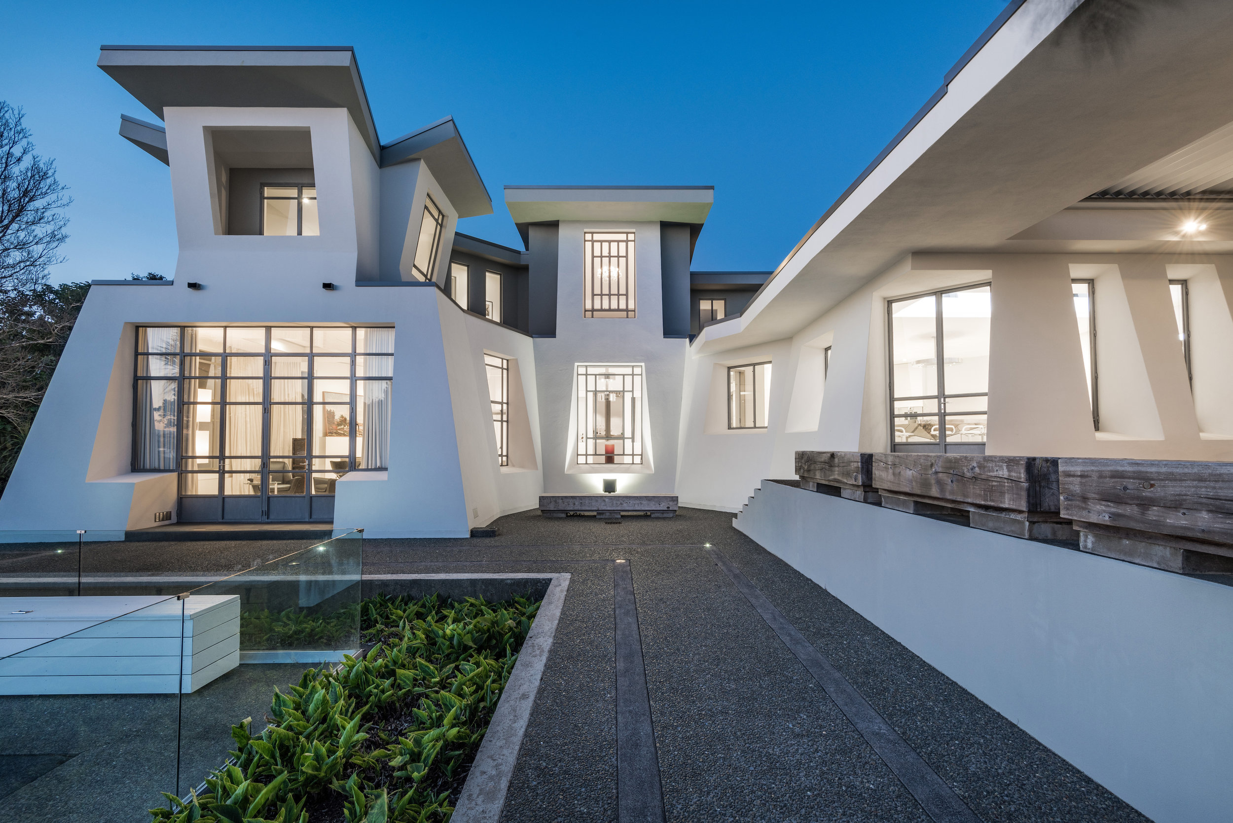  Designed and built over 25 years ago, this family home was created with the absolute intent to withstand passing future trends.  Using the aesthetic strength of irregular angles and lines for the exterior, contrasting the skeletal structure of the stark white interior, this oasis in the middle of a bustling city boasts space and stillness that will continue to hold its place for time to come. 