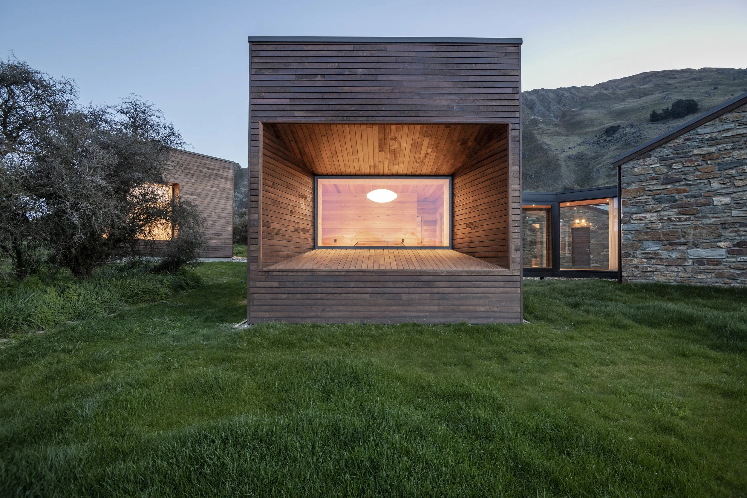  Staying true to the rough and raw beauty of the Central Otago region, we have used locally sourced timber and Otago schist to construct a village of interconnected geometric spaces.  Sitting amongst the spectacular beauty of the Southern Alps this design endeavours never to compete with, but to sit in harmony with the surrounding landscape. 