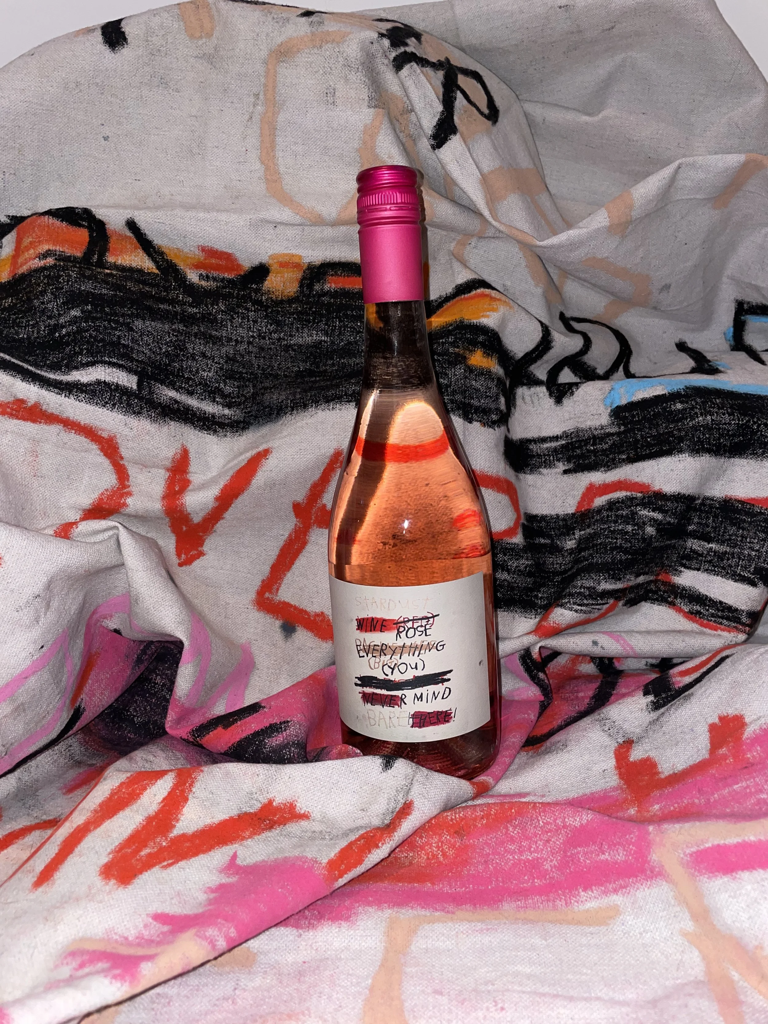 Postino taps Gino Belassen for "Nevermind Rosé" wine label.