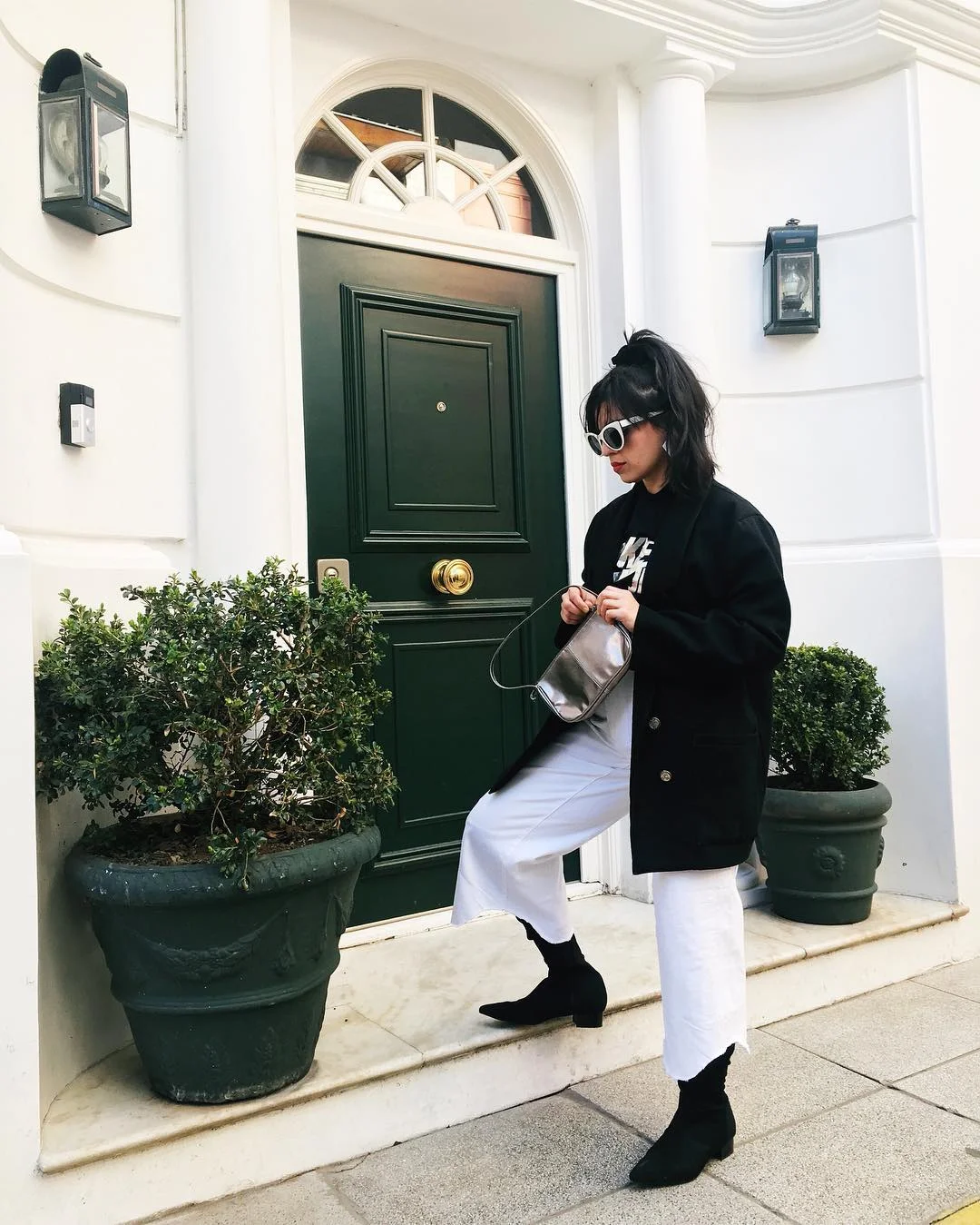 The coat is from Salvation Army, shirt is Nike Japan, and the purse is a vintage find from the charitable organization Feria Misericordia in Buenos Aires.