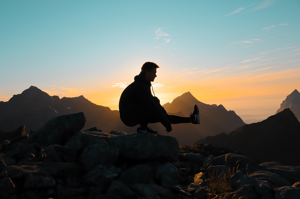 Man balancing on rock.jpg