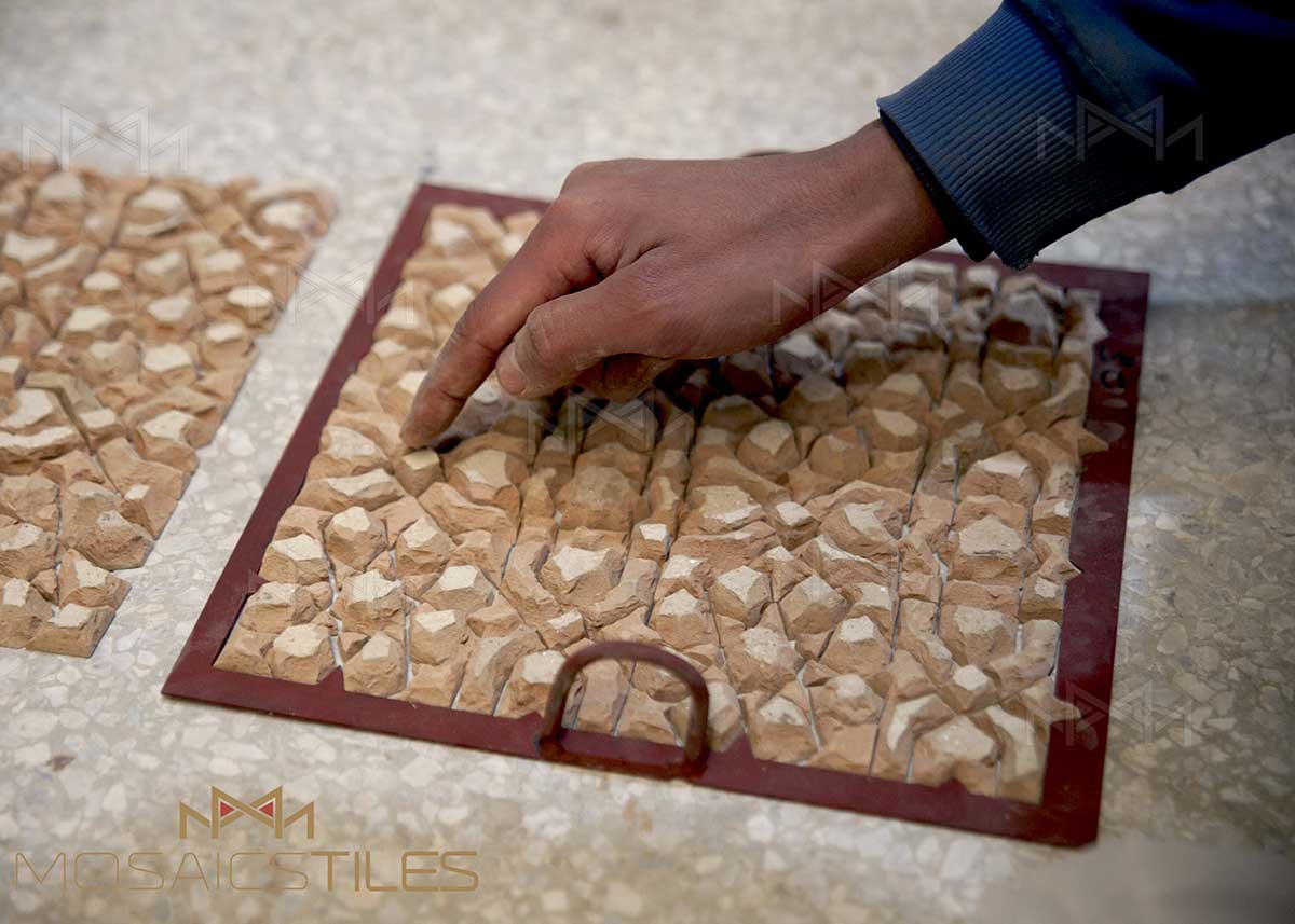 placing zelliges tiles in facility of Casablanca