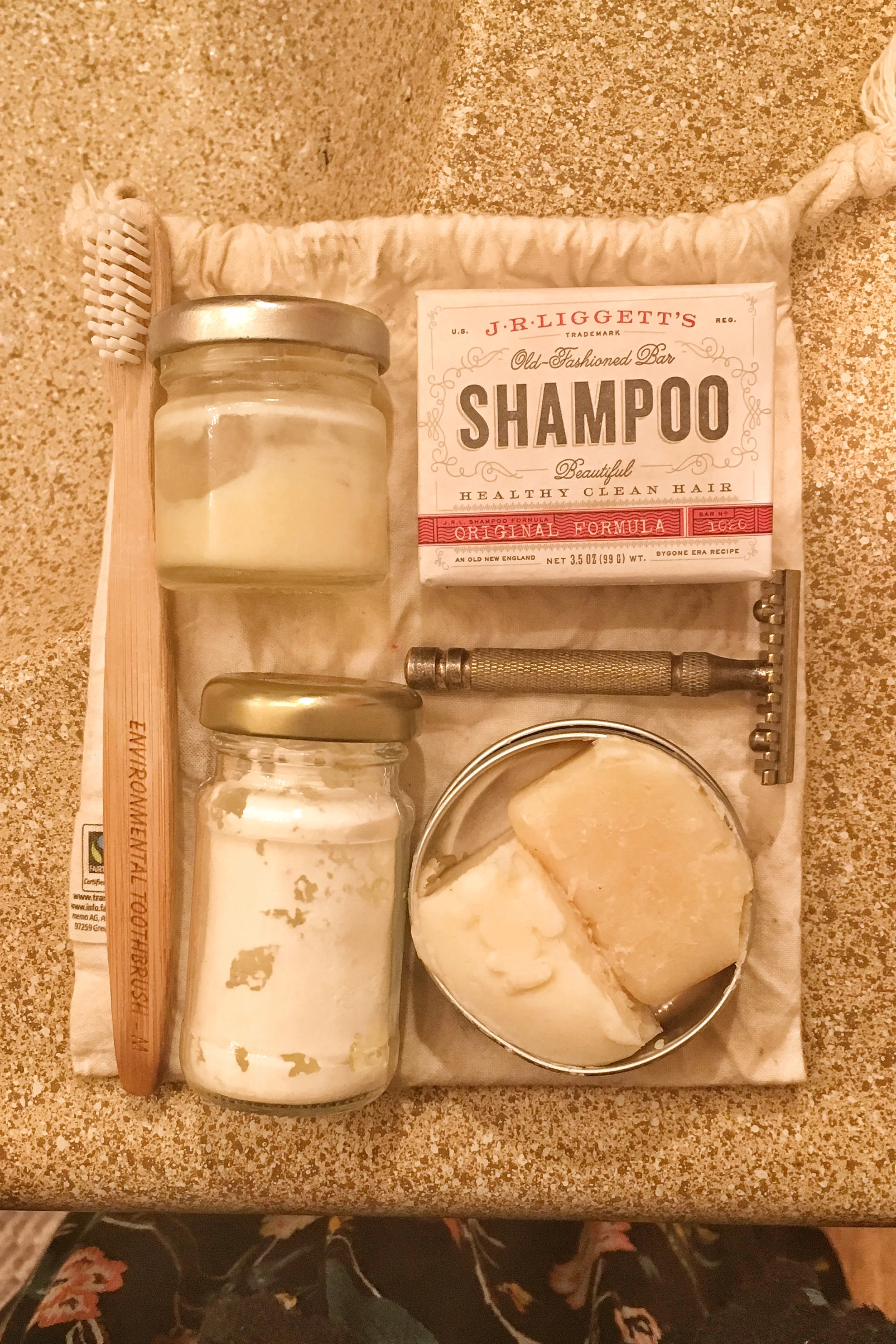 Such an easy little bathroom set and so light and portable - solid shampoo, conditioner and soap. Homemade dry shampoo, a safety razor, homemade deodorant and a bamboo toothbrush