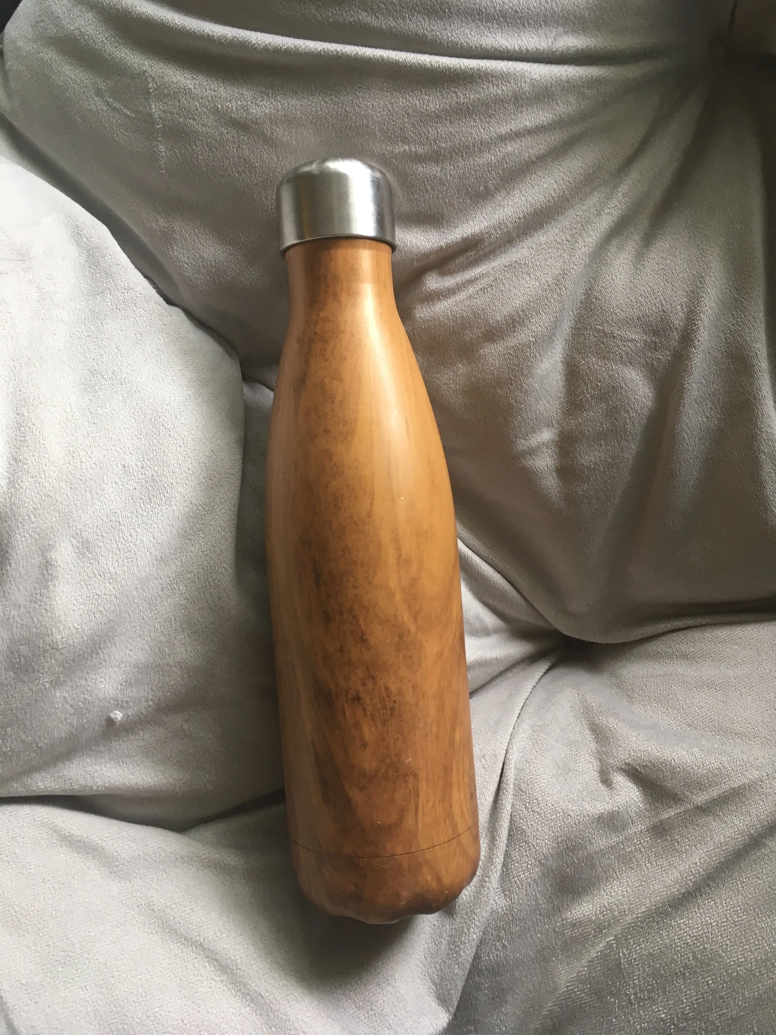 Stainless steel water bottle - a little heavier then a plastic one, but sturdy, keeps drinks hot or cold and no worries about nasties leaching out of the plastic and into the water