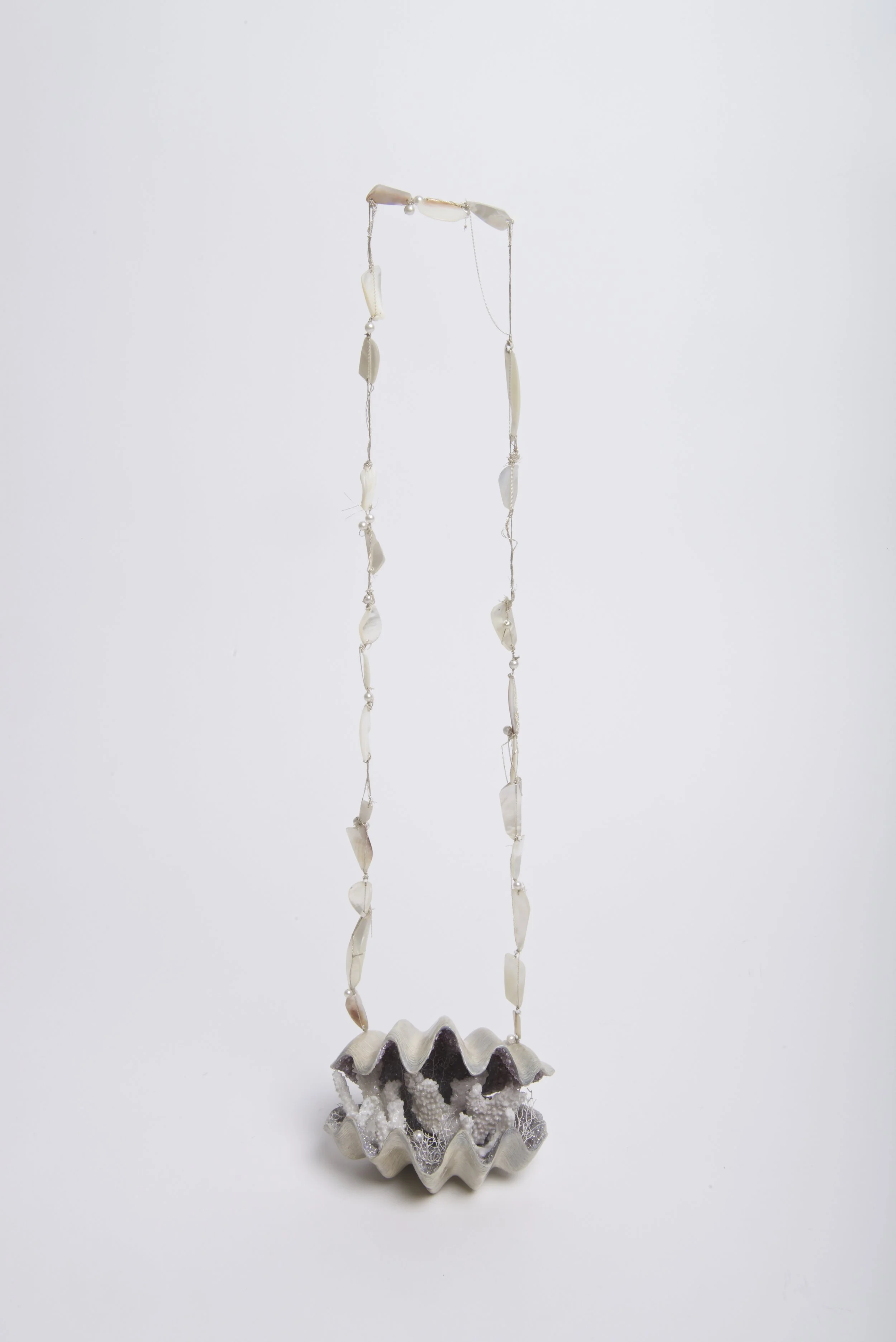 Eden 22” x 6.5” x 4.5” Resin, glass beads, mother of pearl, pearl, silk thread, sterling silver, coral, sugar, sand It is a powerful thing to be forming within the body of a person who knows that they cannot keep you even though they want to. My birth mother was also adopted. She was 16 years old and unmarried when I was born. She never knew her biological family, as I have never known mine. From what I understand through the testimony of the nuns at the orphanage, my biological mother’s adoptive mother was abusive to her. Despite the fact that she wanted to keep me, she knew that doing so would subject me to the abuse that she was suffering. By letting me go, she was protecting me.