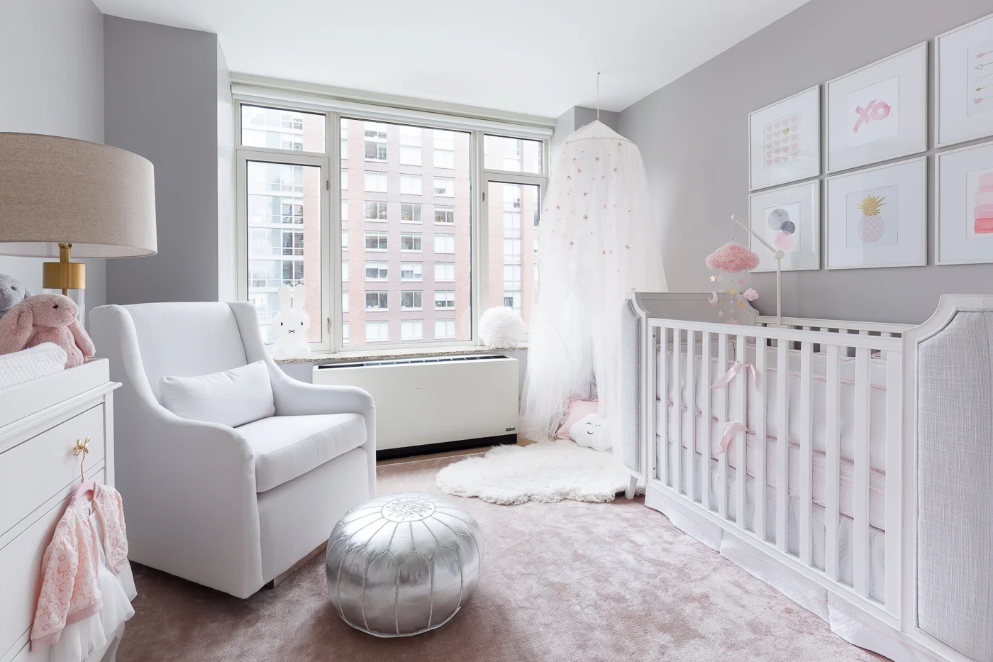 We laid out all of the essentials with maximum function. Once we had a the layout finalized, we started looking for specifics. The color palette we came up with is grounded in neutrals with blush accents to add a touch of baby girl. We always want to maximise function in our design, so all our bigger purchases are gender neutral and convertible so they can be used when our clients have their second baby. We left plenty of empty space in the middle of the room for the essential tummy time and block building. 