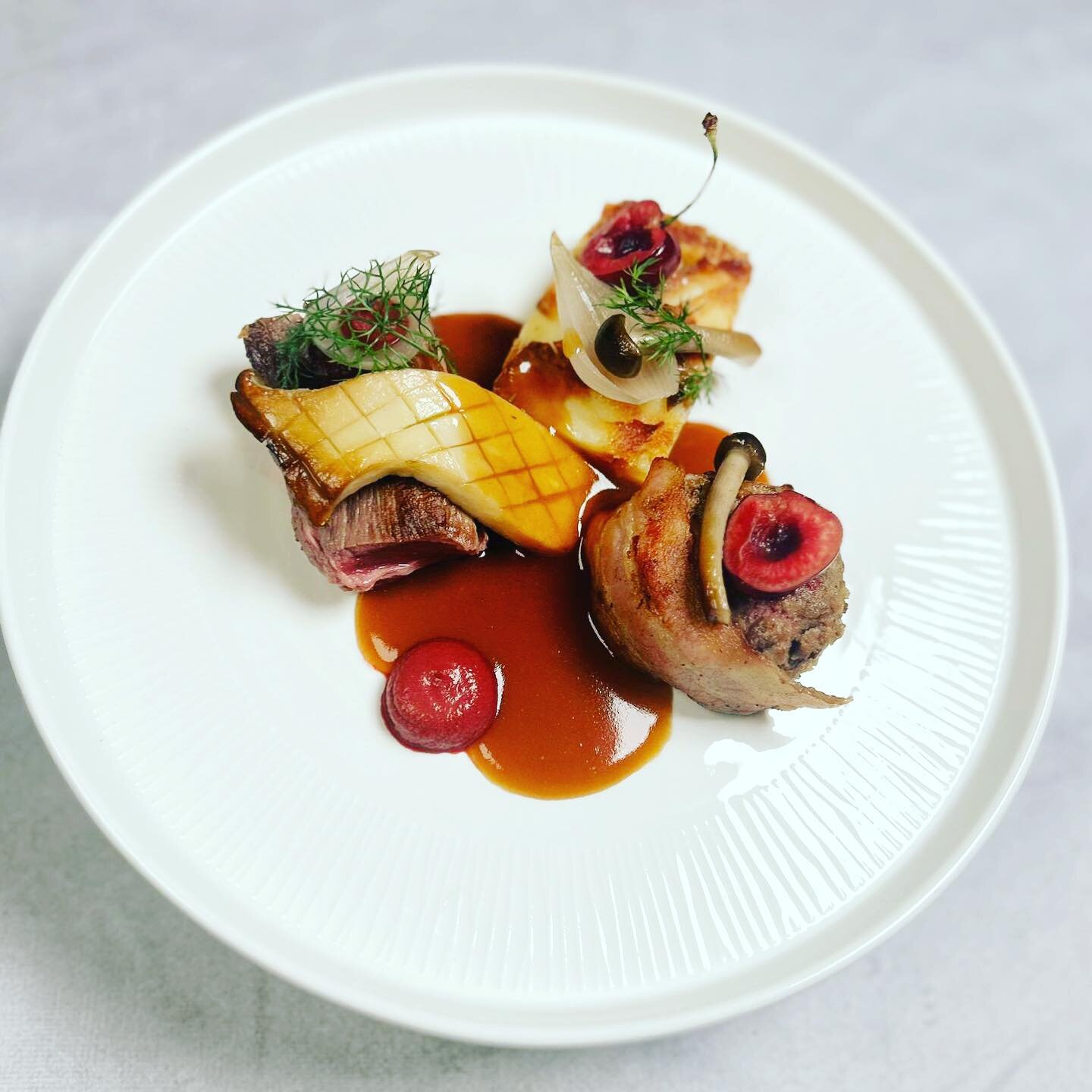 ⚡️Hampton Court Venison⚡️marinated Loin, Smoked bacon wrapped Venison Faggot, turnip &amp; potato terrine, pickled Oakchurch cherries, roasted Cep &amp; Red wine Jus 🤤 one of our new Winter main courses - New wedding brochure available in Bio. #rose